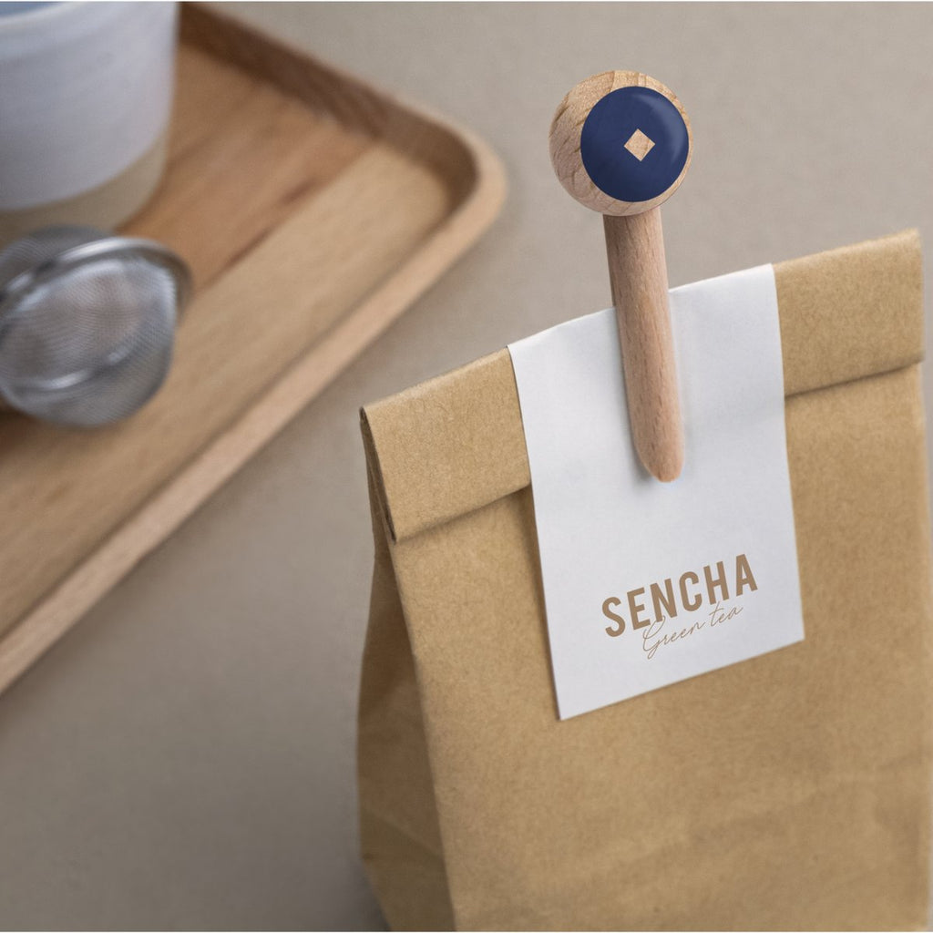 paper bag with blue and brown peg