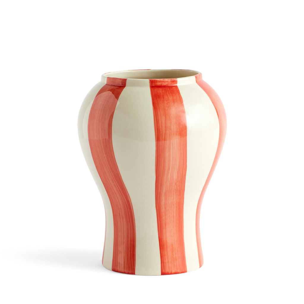 Vase with red and white striped pattern on a white background
