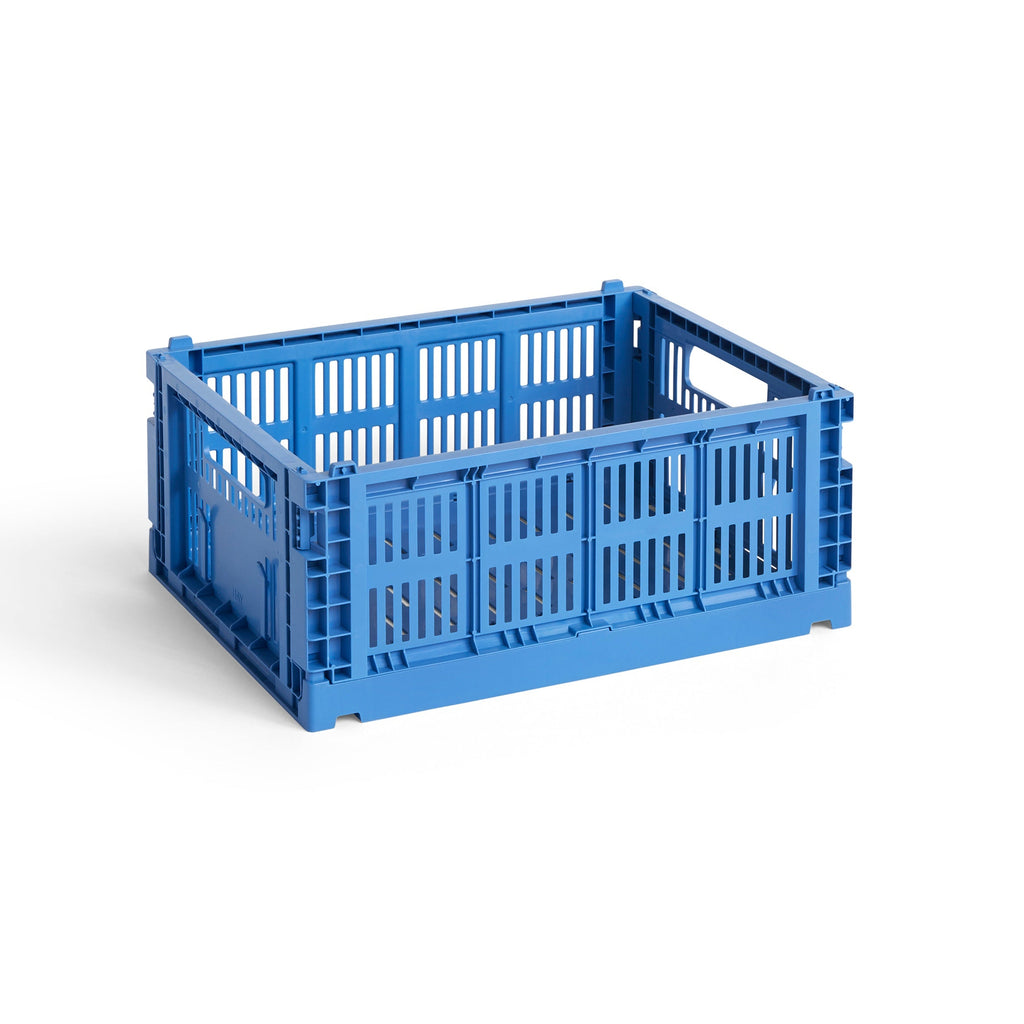 Blue plastic crate on a white background