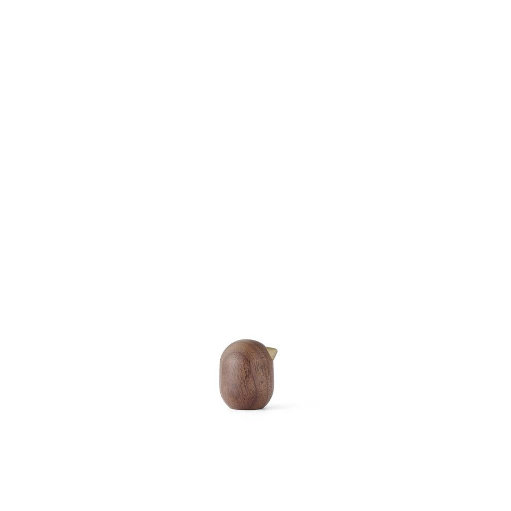 Small brown object on a white background