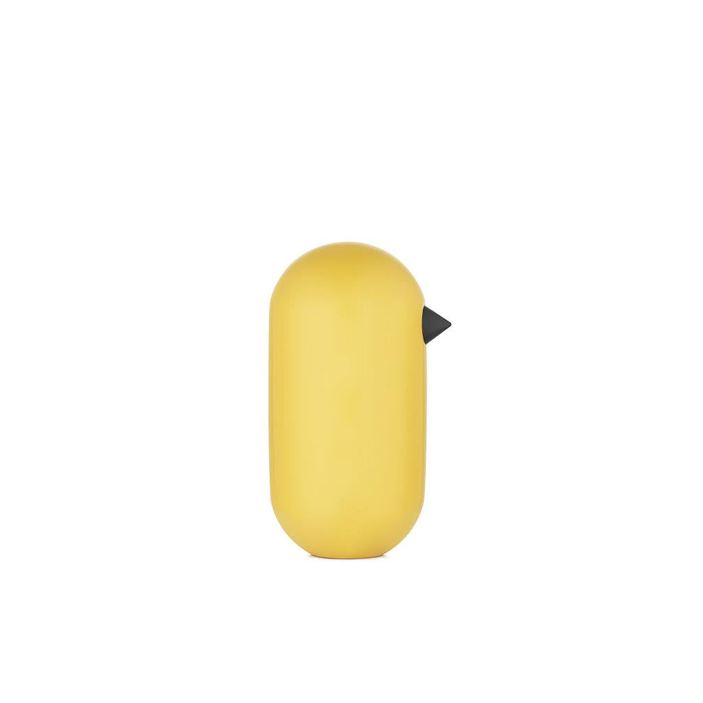 Yellow cylindrical object with a black cap on a white background