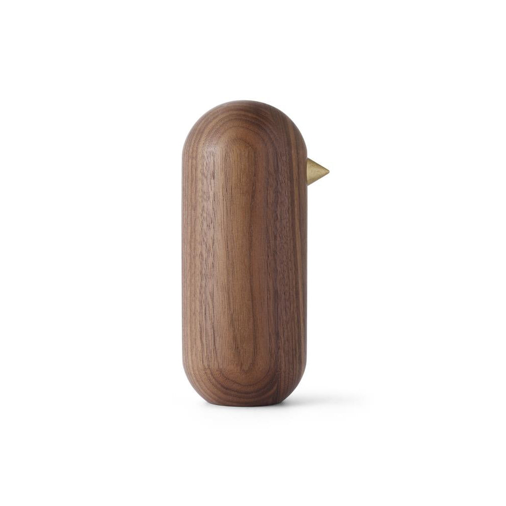 Wooden bird-shaped object on a white background