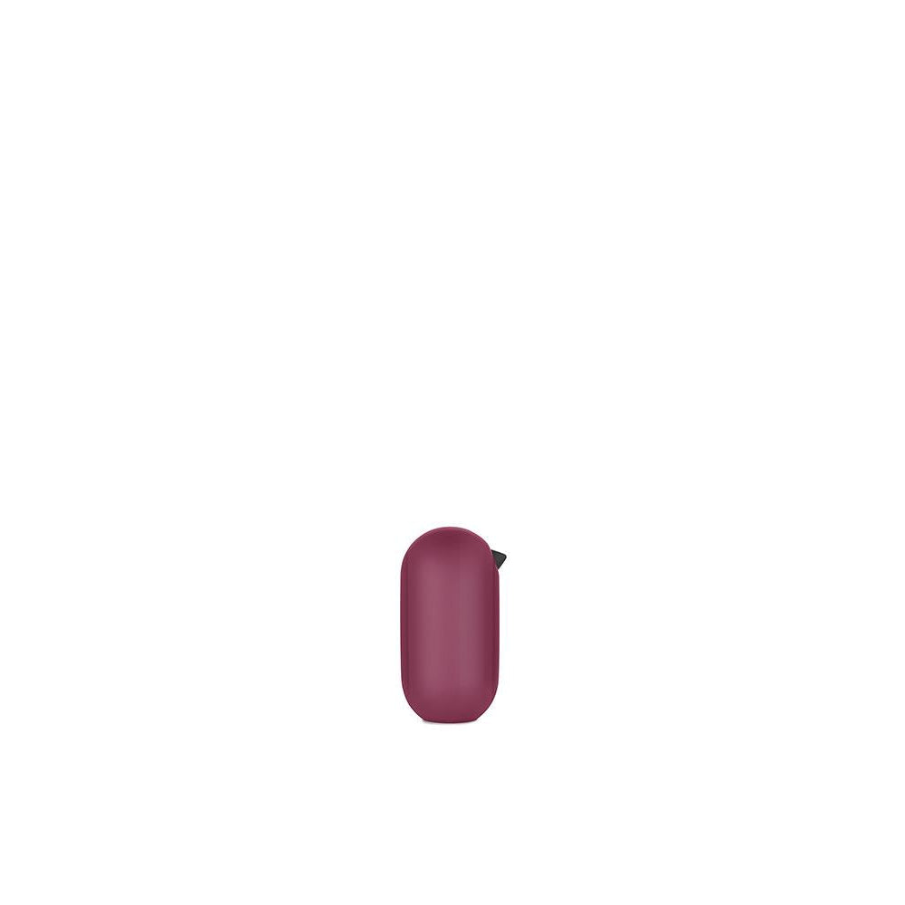 Small purple cylindrical object on a white background