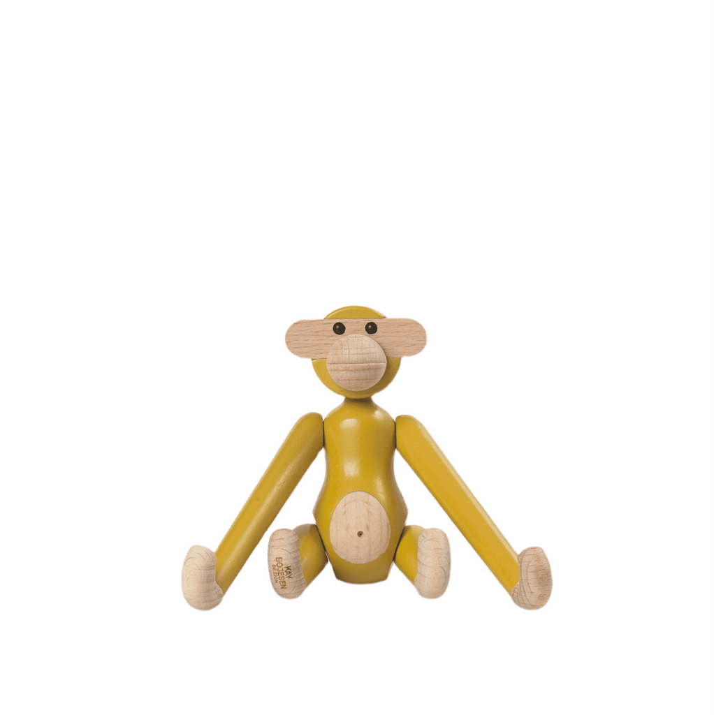 Wooden monkey toy on a white background