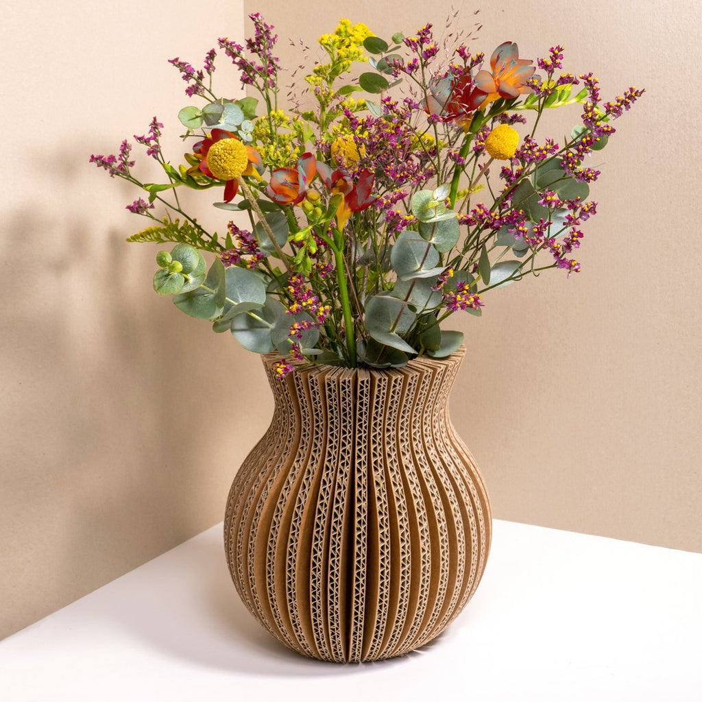 cardboard, sustainable vase with flower arrangement