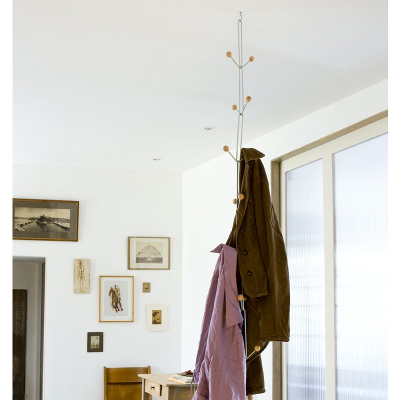 hanging coat rack with jackets on it